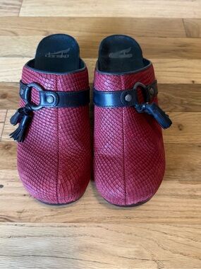 Dansko Red Textured Leather Clogs with Black Strap and Tassel